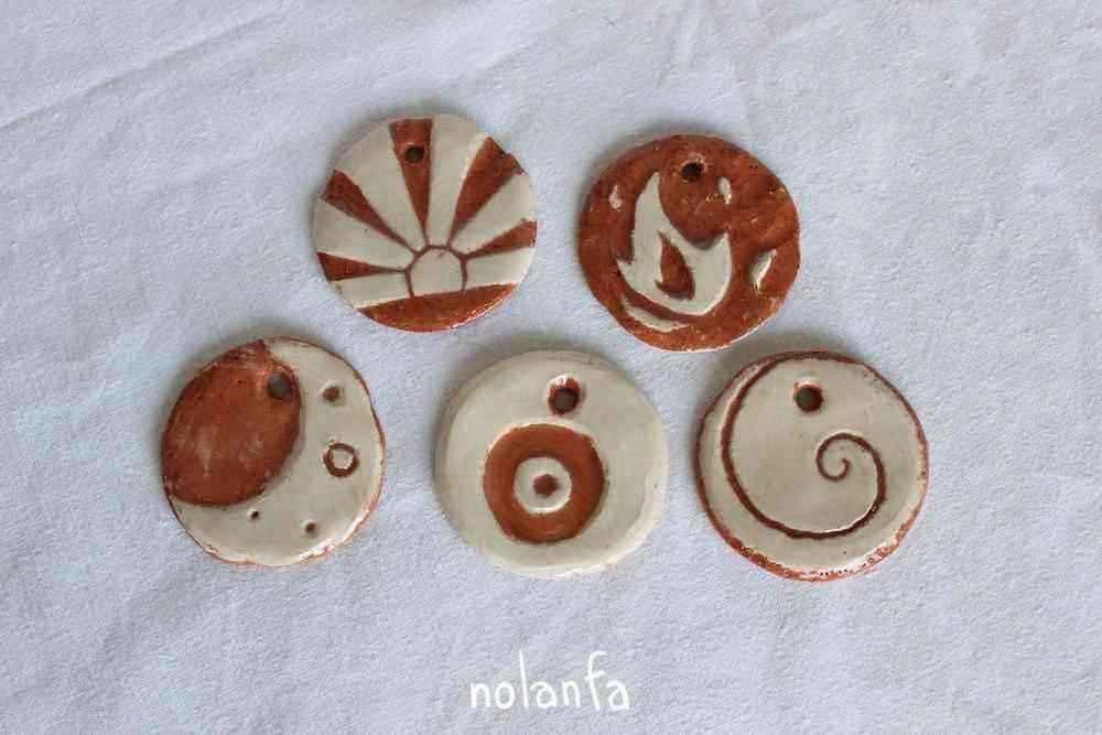 sky medaillons and symbols ones: moon, sunAsia, fire, spiral, eye abstract