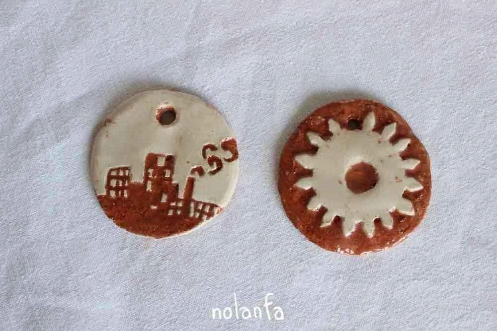artificial medaillons: cogwheel, skyline