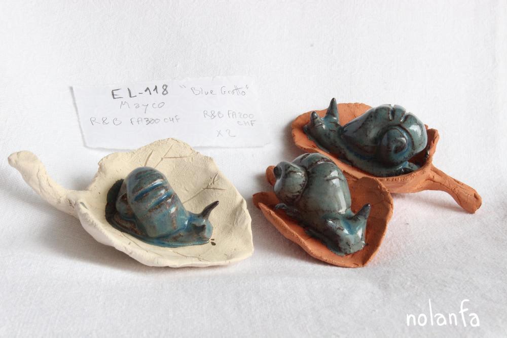 three blue greenish gray snails