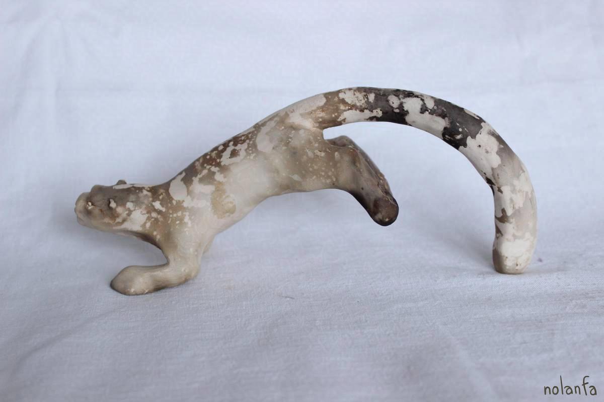 smoked mini snoleo leaping, with white pattern over dark